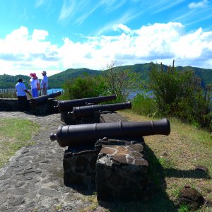 Ancient cannons stand guard over a Caribbean island.