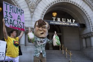 A protester dressed as a caricature of Republican presidential nominee Donald Trump rallies in front of the new Trump International Hotel on Pennsylvania Avenue in Washington, DC, USA, 12 September 2016. The Trump International Hotel opens today, with its grand opening ceremonies scheduled for 24 October 2016. EPA/SHAWN THEW