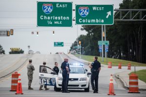 Local law enforcement works with members of the National Guard to keep an evacuation route clear on I-26 during preparations for the expected arrival of Hurricane Matthew in Charleston, South Carolina, USA, 06 October 2016. Hurricane Matthew has crossed over parts of Haiti and Cuba and is expected to move up the east coast of the United States. EPA/SEAN RAYFORD