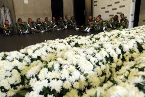 Members of a Colombian army band rest next to bouquets of flowers during preparations for the tribute to the members of Brazilian soccer team Chapecoense who died in the 28 November plane crash, at the Stadium Atanasio Girardot, in Medellin, Colombia, 30 November 2016. 71 people died when an aircraft crashed late 28 November 2016 with 77 people on board, including players of the Brazilian soccer club Chapecoense. The plane crashed in a mountainous area outside Medellin, Colombia as it was approaching the Jose Maria Cordoba airport. Chapecoense were scheduled to play in the Copa Sudamericana final against Medellin's Atletico Nacional on 30 November 2016. EFE